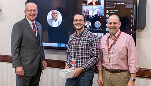 CTC president and CEO Ed Sheehan (left) and CTC Executive VP and COO George Appley (right) congratulate the team on this successful patent. Shawn Rhodes (centre) attended the recognition ceremony along with the rest of the team, who joined via video conference (Courtesy CTC)