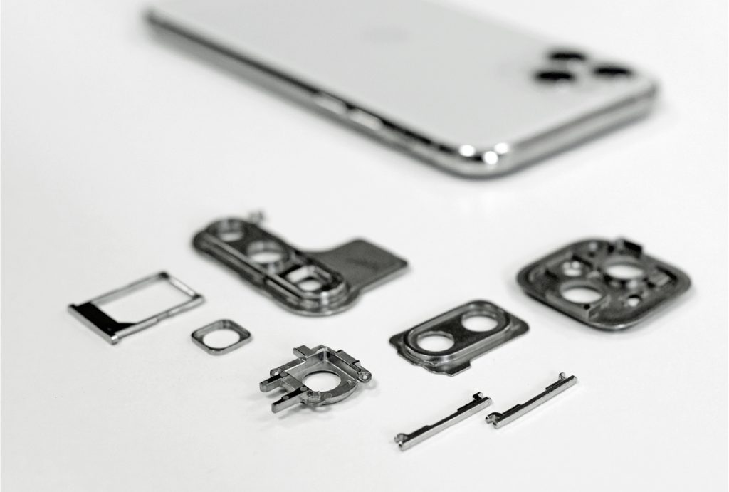 Fig. 2 Various components for smartphones including SIM card trays, volume buttons and camera frames (Photo PIM International)