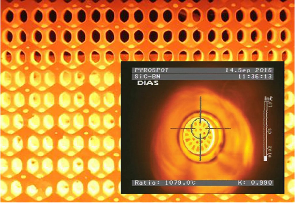 Fig. 1 Examples of complex ceramic structures for high-temperature applications. A porous burner in the background (Courtesy EngiCer) and a heat exchanger [1] (Courtesy SUPSI)