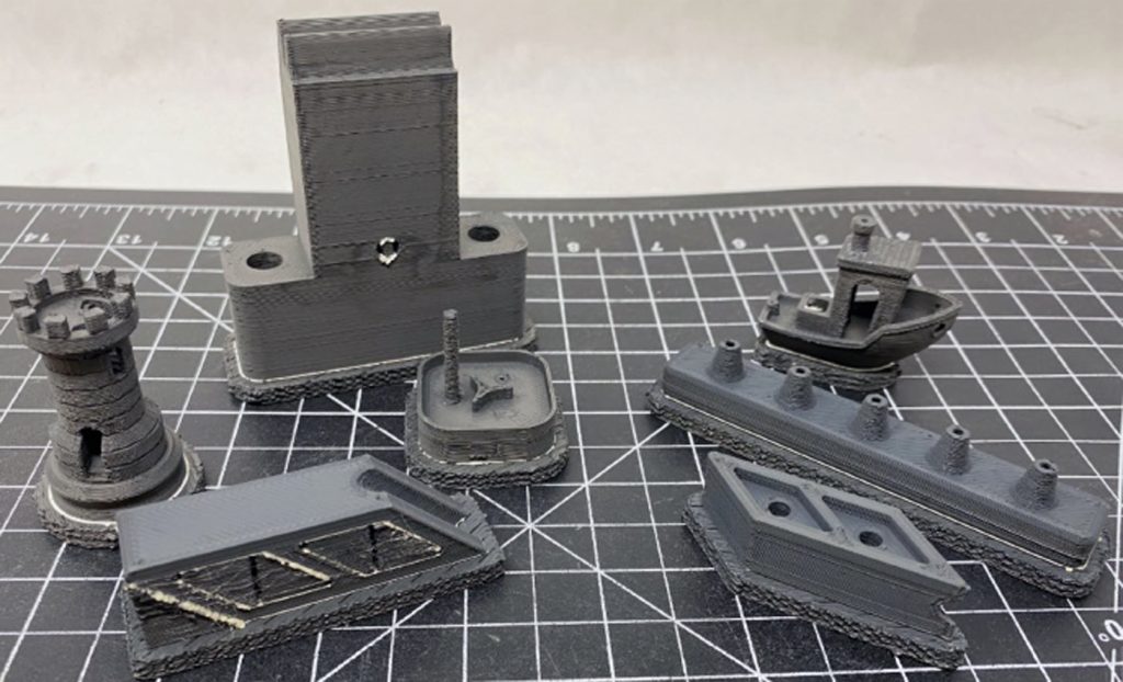 Fig. 11 Several examples of tungsten carbide parts produced on Desktop Metal’s Studio machine, in the as-built state [12]