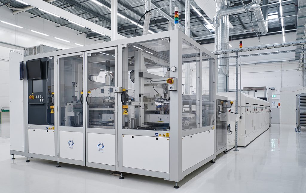 Fig. 5 Exentis’ production system suitable for industrial mass production with one printing unit (foreground) and a long drying unit (background) (Courtesy Exentis Group AG)