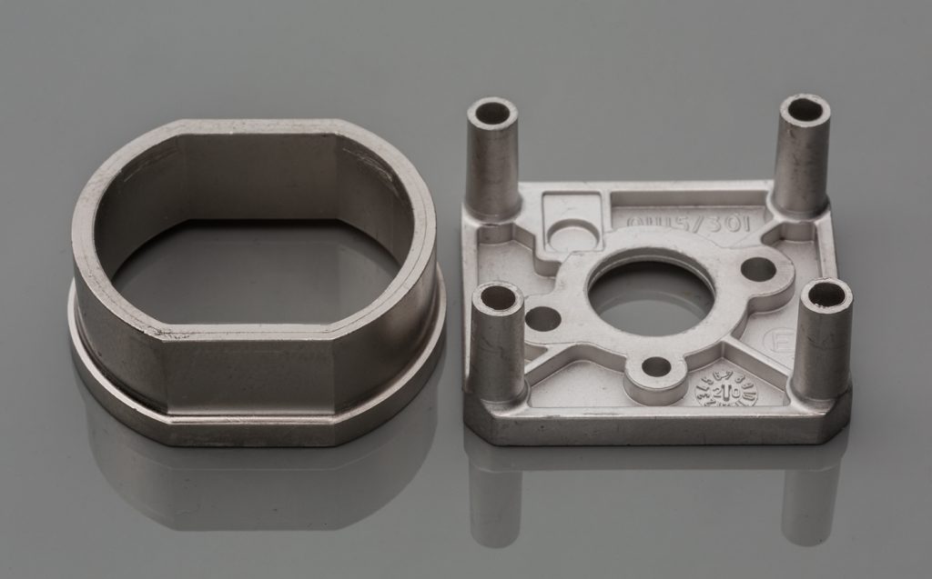 Fig. 8 Components used in a ventilator’s gas analysis system. There was a significant ramp up in the production of these parts during COVID-19. The left part is made from nickel iron, and the right part from 316L stainless steel (Courtesy CMG Technologies)