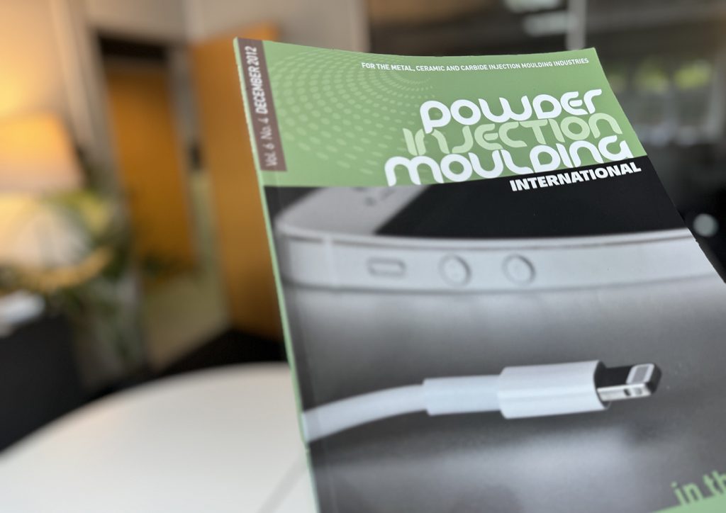 Fig. 1 The December 2012 issue of PIM International with Apple’s MIM Lightning connector on the cover