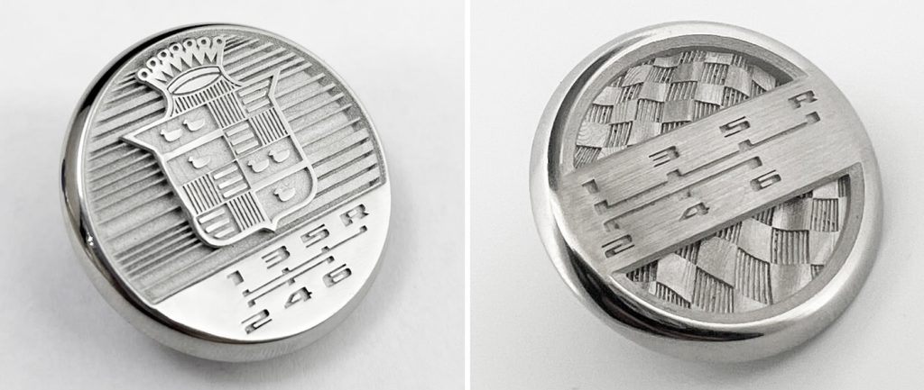 Fig. 12 Left: General Motor’s 120th anniversary edition shift knob emblems, manufactured for single edition of only 120 vehicles; Right: Emblem for General Motor’s special edition competition package vehicles, manufactured in limited edition. Both are produced from 316L by BJT (Courtesy Azoth)