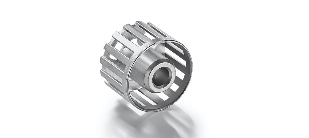 Fig. 14 Cage for an electric diameter made of soft diameter pure iron. The part is 17 mm in diameter, has a wall thickness of 0.5 mm, and weighs 12.5 g. Concentricity and ovality are subject to tight tolerance requirements (Courtesy Schunk)