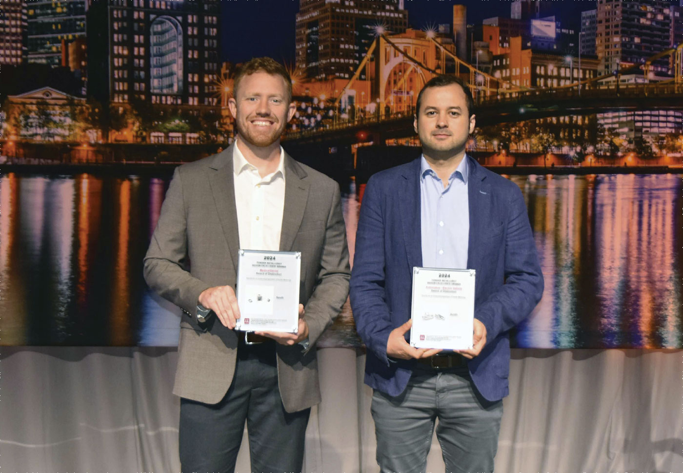 Fig. 16 Cochran (left) and Forgiarini (right) receiving a 2024 MPIF PM Design Excellence Award on behalf of Azoth (Courtesy MPIF) 