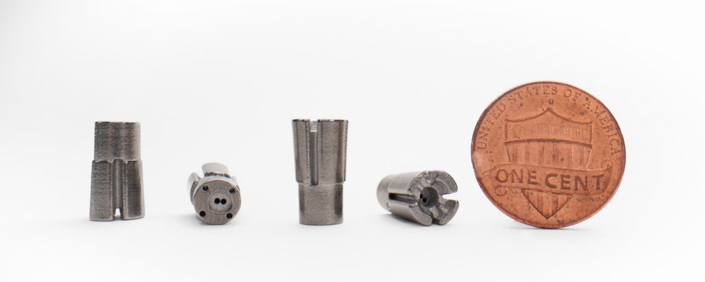 Fig. 15 A medical device gimbal with coin for scale (Courtesy 3DEO)