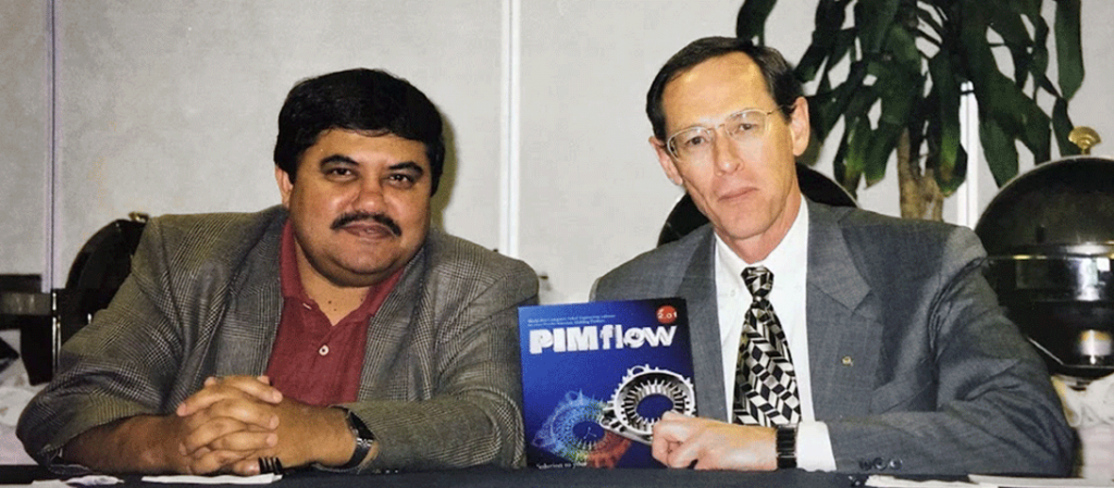 Fig. 2 Animesh (left) and Rand (right) holding PIMflow software, released around 1986–1987 (Courtesy Animesh Bose)