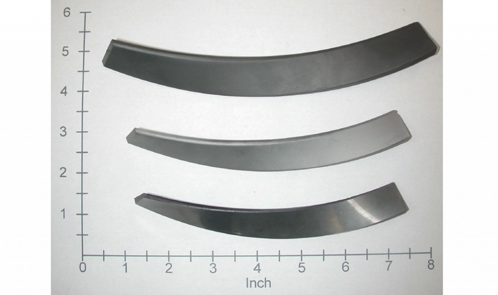 Fig. 5 A hardmetal twist-blade (top: as-moulded; middle: as-sintered; and bottom: sintered and machined) [1]