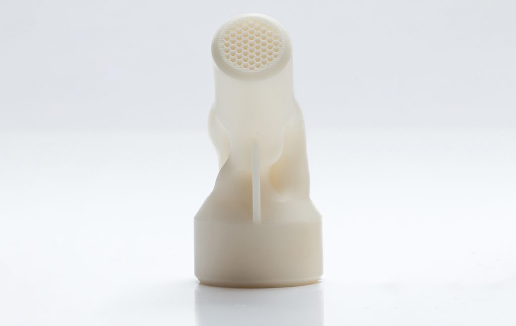 Fig. 1 Ceramic gas injector produced by Lithoz’s Lithography-based Ceramic Manufacturing (LCM) process, with three internal channels and sixty-two flow-optimised outlets (Courtesy Lithoz)