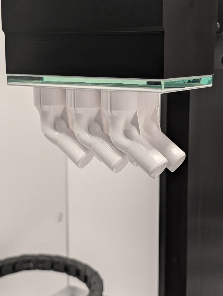 Fig. 2 Six injectors on the LCM build platform after a build (Courtesy Bosch Advanced Ceramics)
