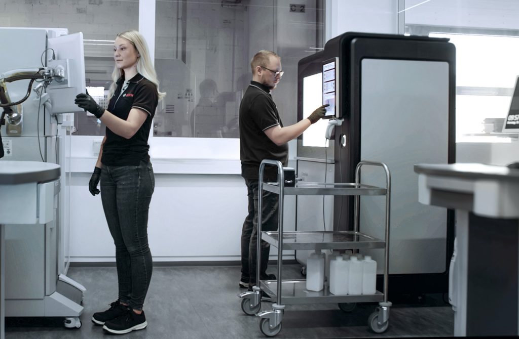 Fig. 4 Lithoz CeraFab AM machines in a production area at Bosch Advanced Ceramics (Courtesy Bosch Advanced Ceramics)