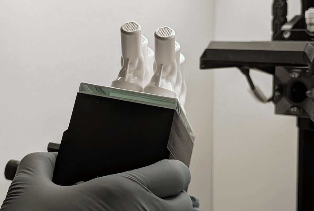 Fig. 6 An operator removing the build from the CeraFab machine (Courtesy Bosch Advanced Ceramics)
