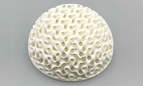 An additively manufactured ceramic GRIN lens produced on the FLUX CORE machine with High Purity Alumina (99.8%) (HP-A 98) resin (Courtesy Tethon 3D)