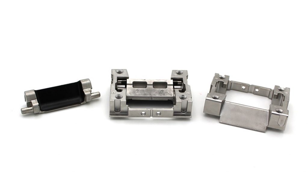Fig. 7 INDO-MIM: caravan hinge pocket and keeper module components (Courtesy MPIF)