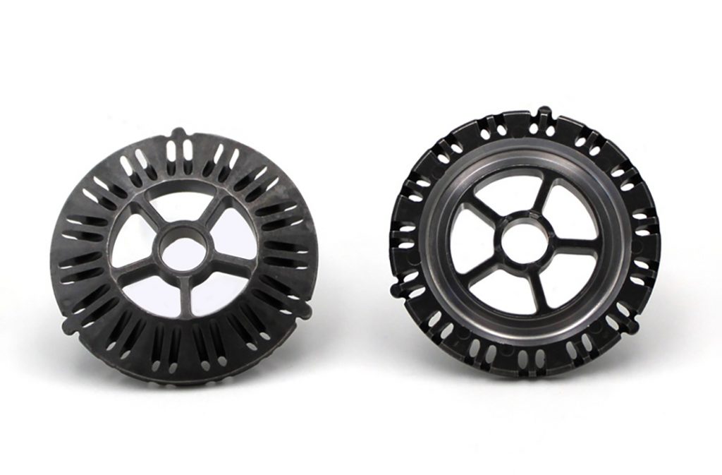 Fig. 9 INDO-MIM: ASV top plate for vehicle suspension with high complexity (Courtesy MPIF)