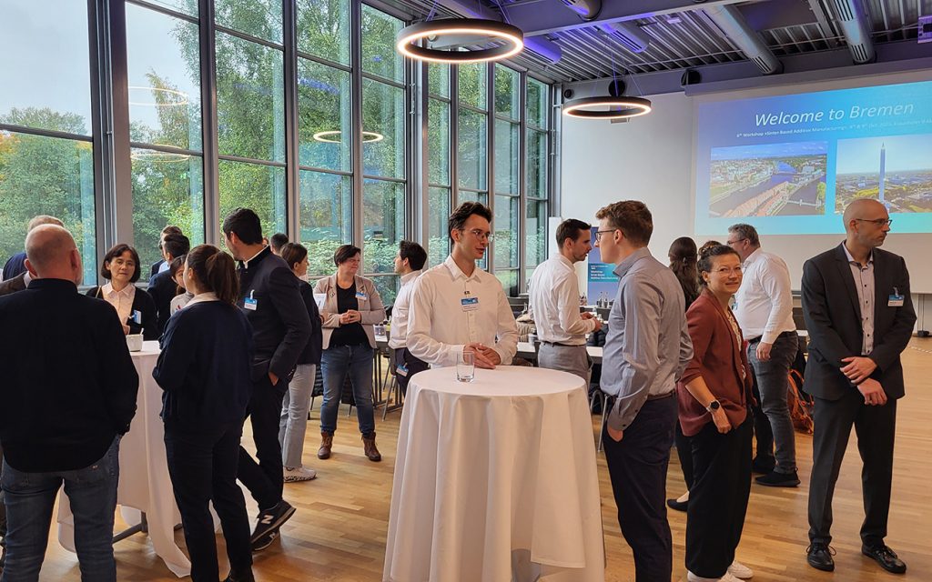 Fig. 1 IFAM’s Sebastian Hein welcoming participants to the 6th Workshop on Sinter-based Additive Manufacturing (Courtesy Fraunhofer IFAM)