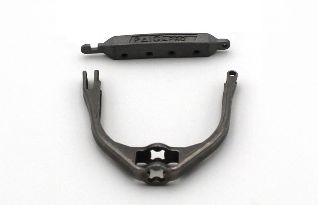 Fig. 14 Nichols Portland: AM capo bar and yoke for banjo (Courtesy MPIF)