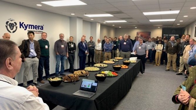 Fig. 2 The evening gathering at Kymera International, with Tom Pelletiers (bottom left) welcoming attendees to the facility (Courtesy Tom Pelletiers)