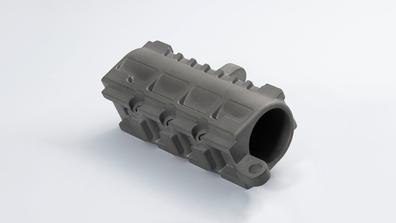 Fig. 2 A MIM titanium universal trunnion used in an innovative rifle platform, manufactured by TriTech Titanium Parts LLC (Courtesy MPIF)