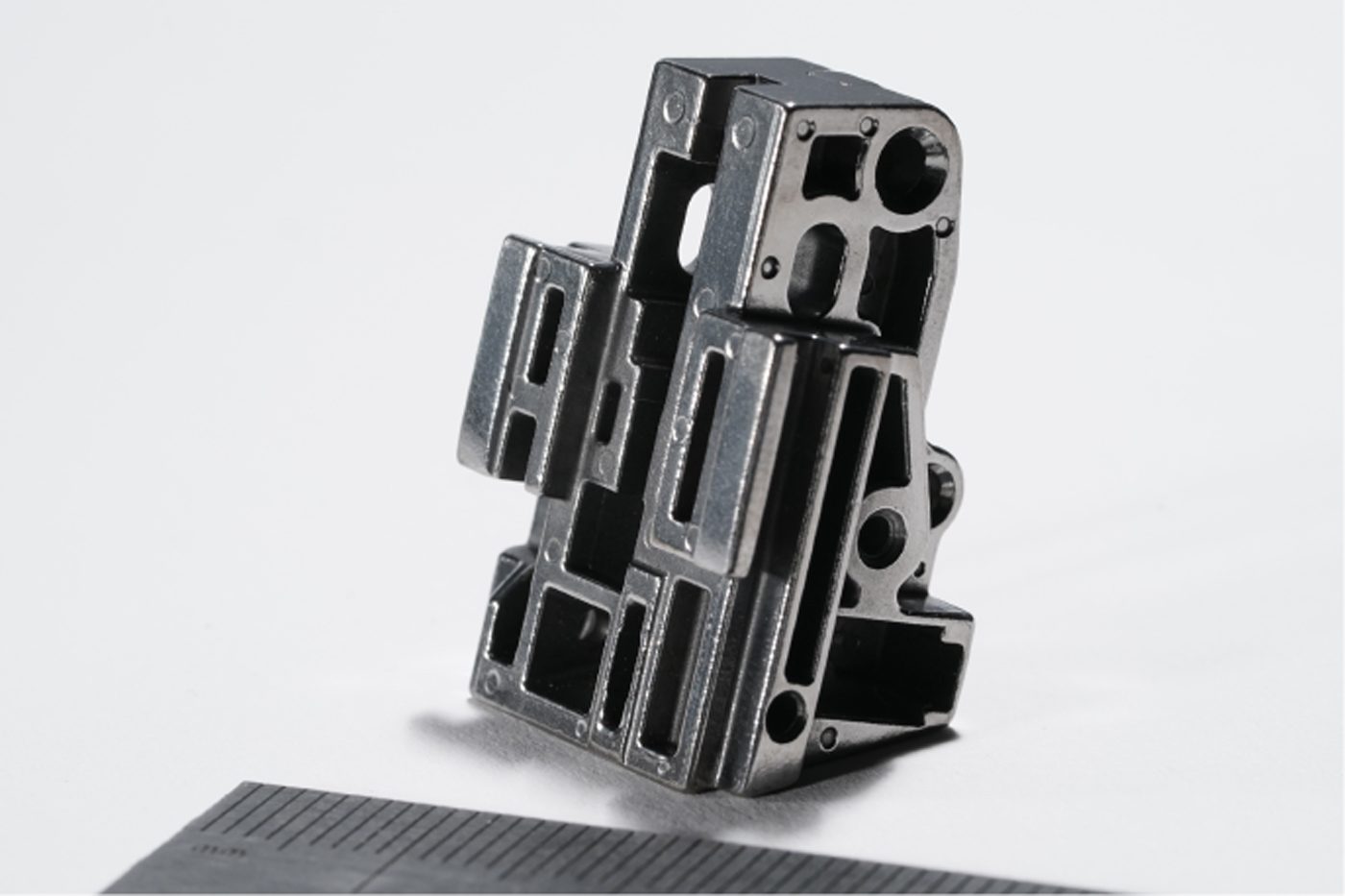 Fig. 2 A fire control housing for the trigger mechanism in a consumer pistol (Courtesy MPIF)