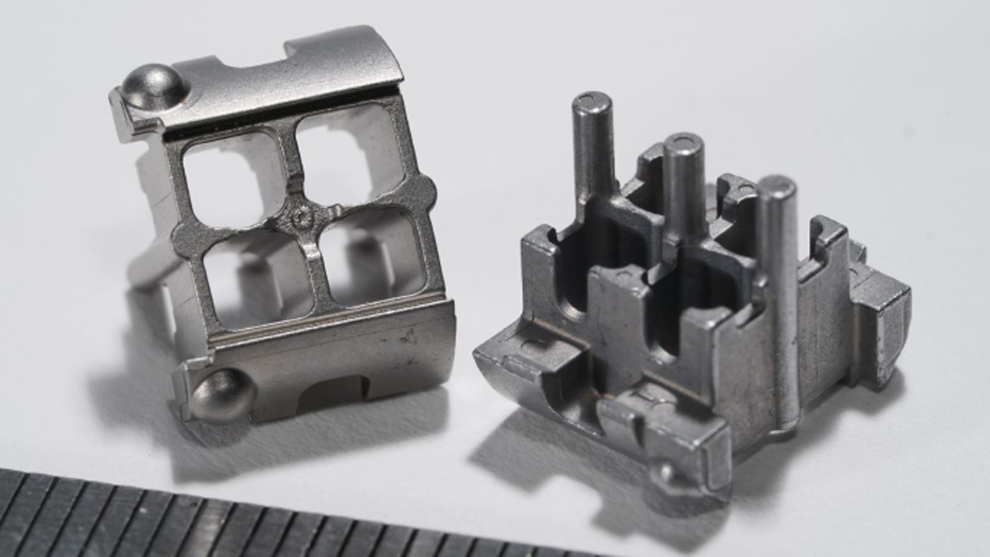 Fig. 4 Components for a quick-change core retaining anti-drill part used in a security door lock assembly (Courtesy MPIF)