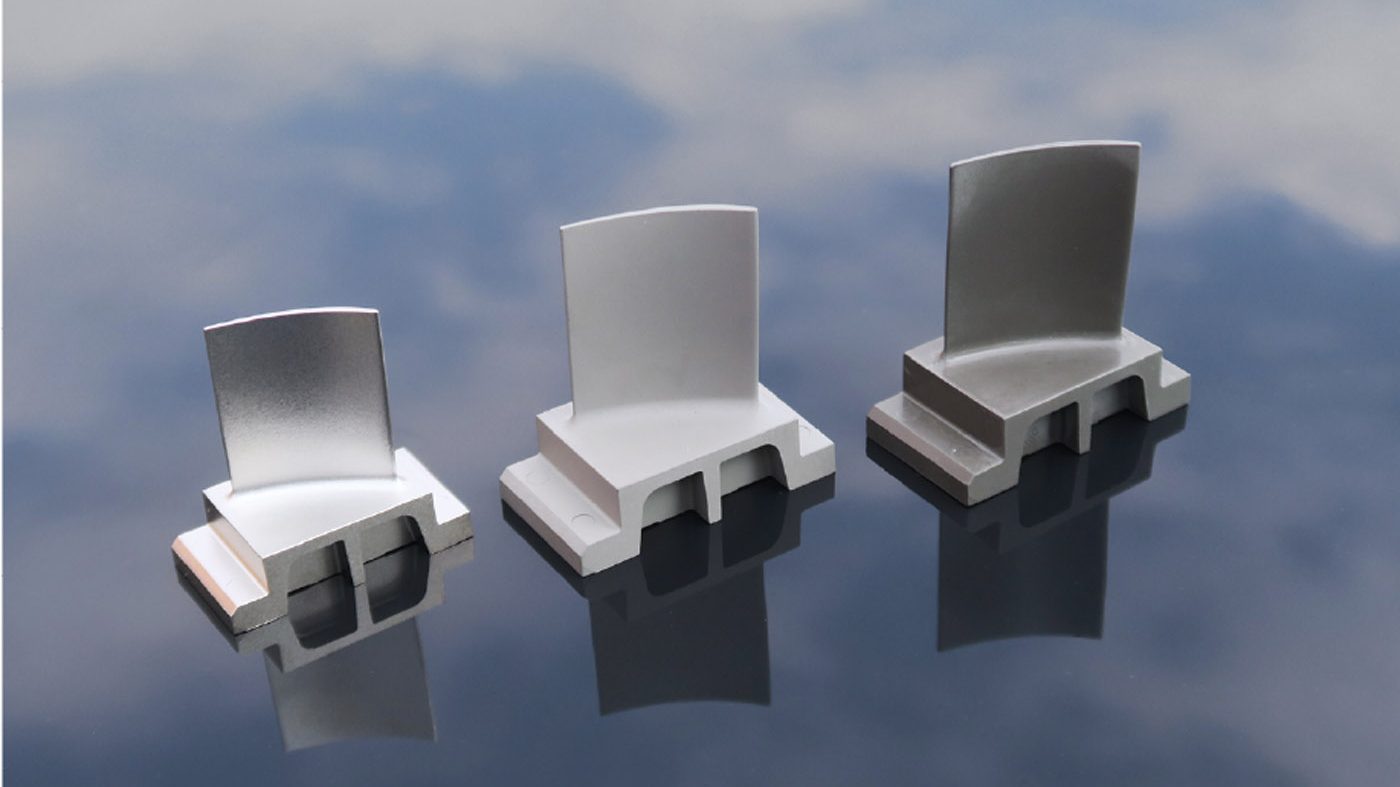 Fig. 5 An example of MIM’s success in the aerospace sector. These IN713LC superalloy stator vanes produced by Schunk Sintermetalltechnik GmbH are now flying in Rolls-Royce aero engines. Parts shown after injection moulding (right), debinding (centre) and sintering (left) (Courtesy Schunk Sintermetalltechnik GmbH)