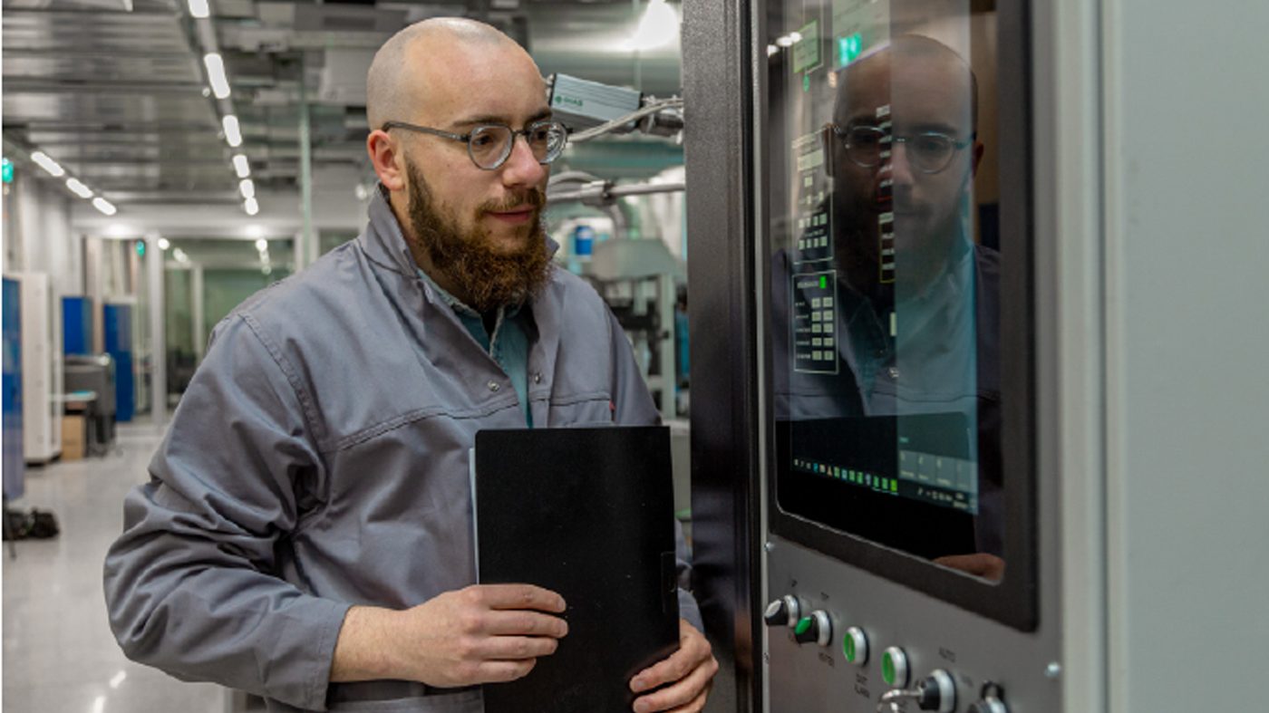 Fig. 6 Oscar Santoliquido, a SUPSI staff researcher, with the laboratory's debinding and sintering furnace from Xerion Berlin Labatories GmbH (Courtesy SUPSI)