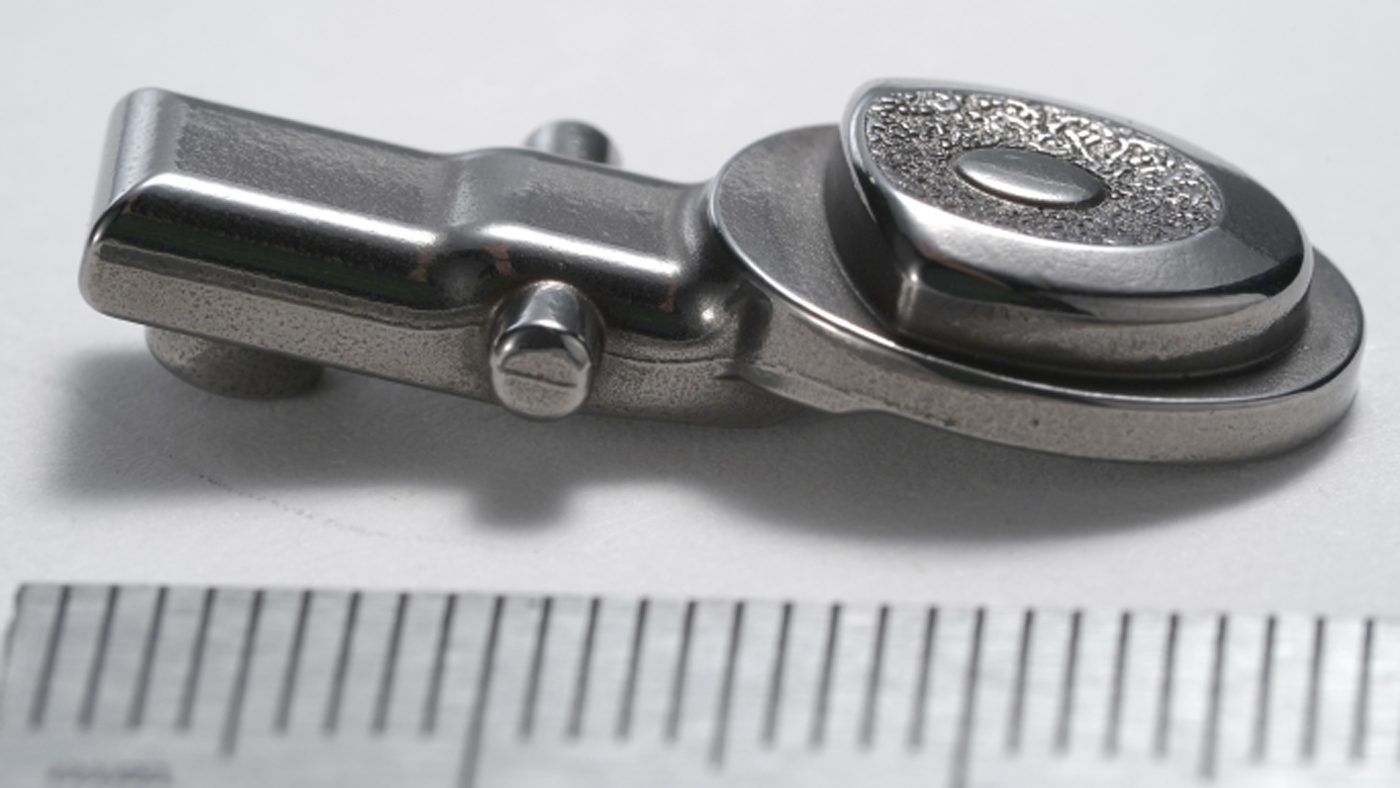 Fig. 11 A lock-arm button used in a pocketknife (Courtesy MPIF)