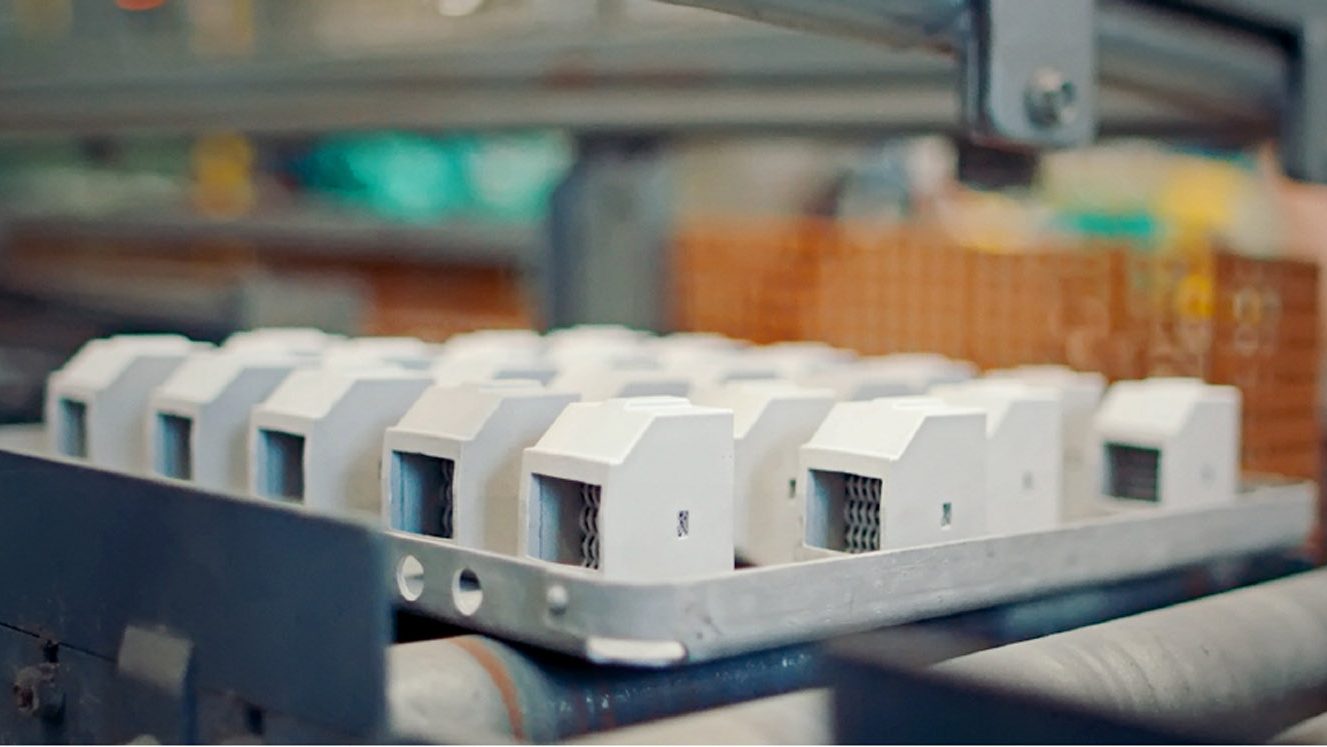 Fig. 13 Filters on sintering trays (Courtesy GKN Additive [Forecast 3D])