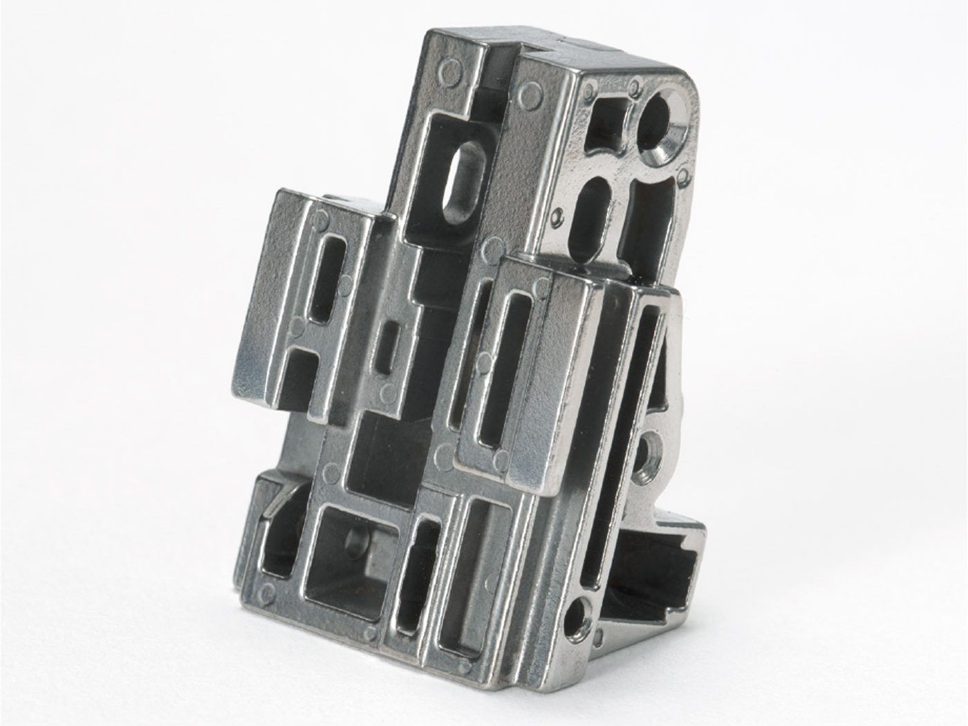 Fig. 14 The firearms sector continues to dominate MIM production in North America. This fire control housing for the trigger mechanism in a consumer pistol won a 2021 PM Design Excellence Award Grand Prize in the Aerospace/Military/Firearms category for MIM components. The part is produced by ARC Group Worldwide, Denver, Colorado, USA, for their customer Palmetto State Armory, Columbia, South Carolina (Courtesy MPIF)