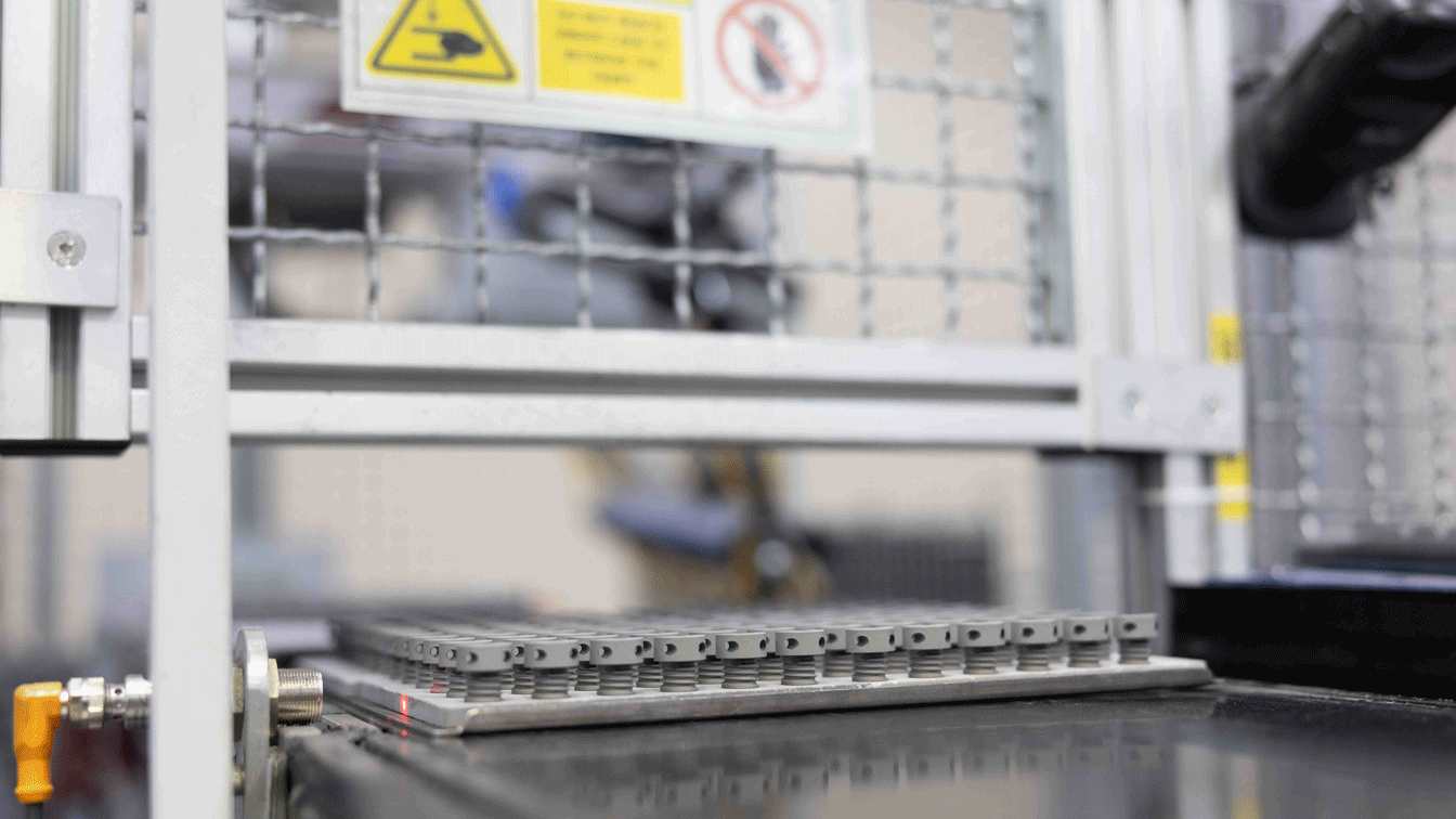 Fig. 15 Green MIM parts on trays prior to sintering (Courtesy INDO-MIM)