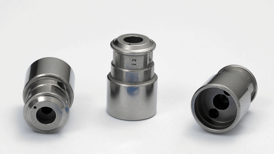 Fig. 19 These cone components, used as fluid controllers in fuel pumps, won an MPIF Award of Distinction (Courtesy MPIF)