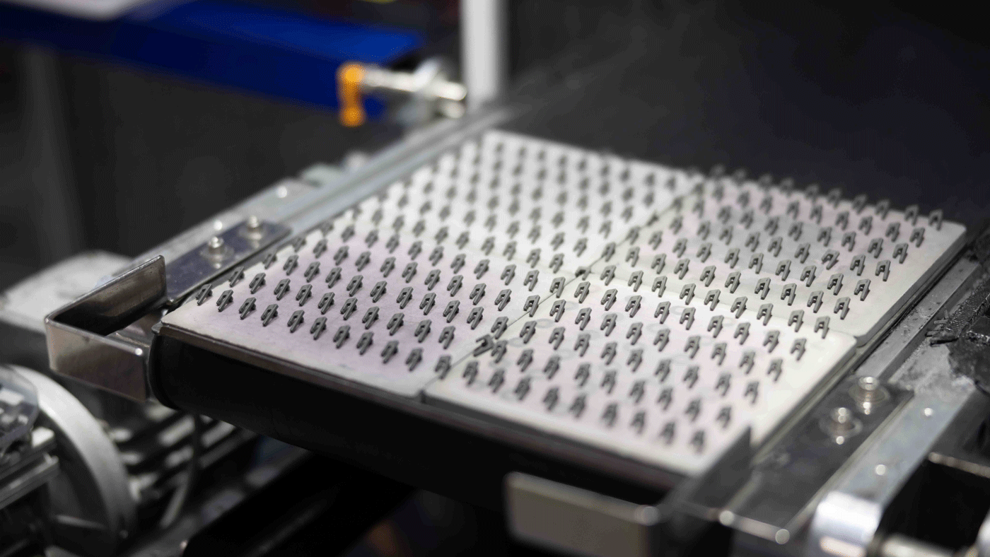 Fig. 21 MIM components on a sintering tray (Courtesy INDO-MIM)