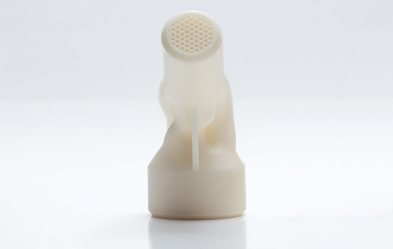 Fig. 1 Ceramic gas injector produced by Lithoz’s Lithography-based Ceramic Manufacturing (LCM) process, with three internal channels and sixty-two flow-optimised outlets (Courtesy Lithoz)